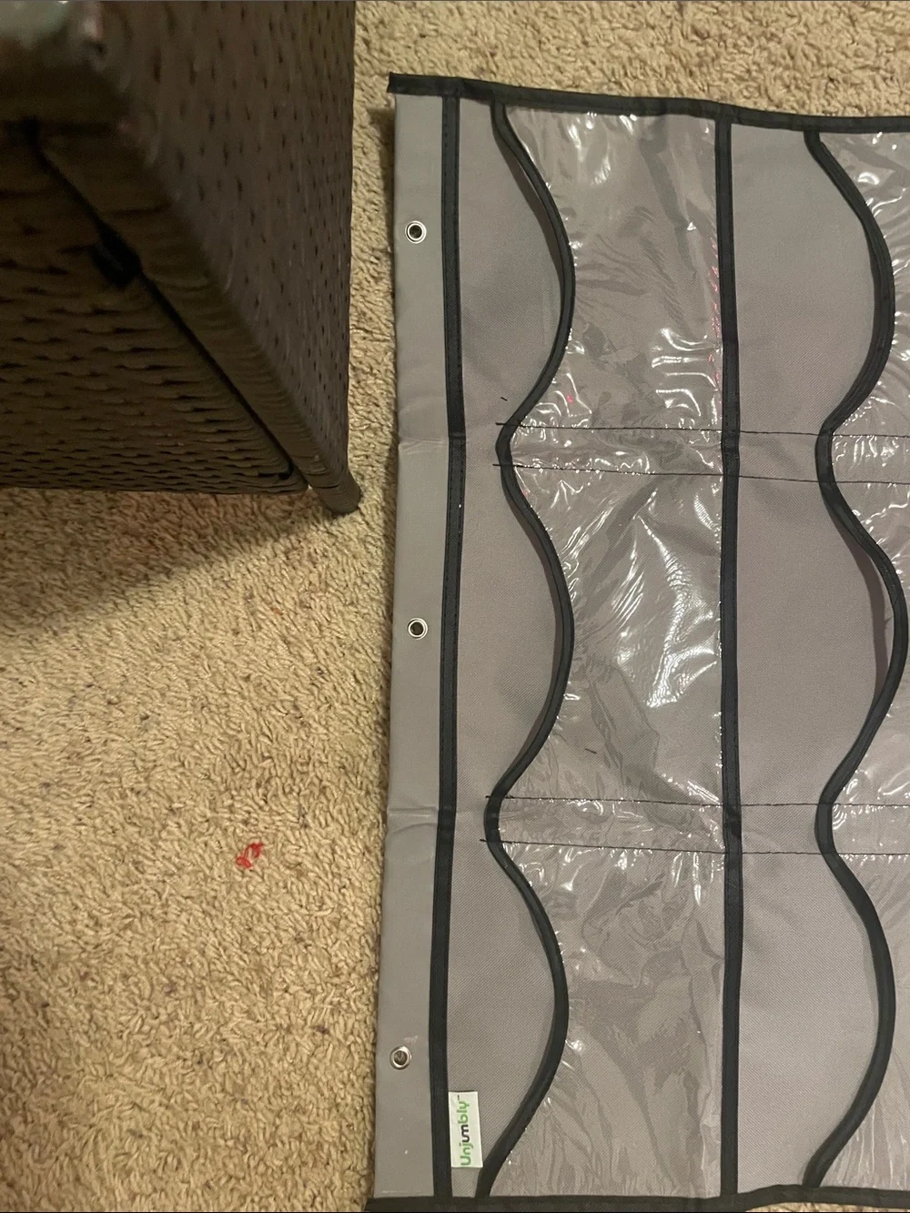 A hat holder that hangs on your door with 3 hooks great